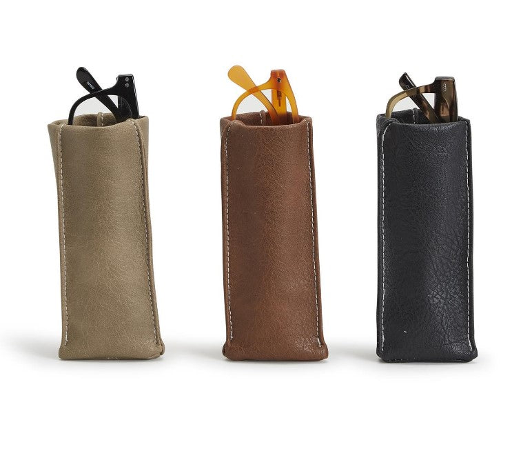 Three leather pen cases in beige, brown, and black on a white background