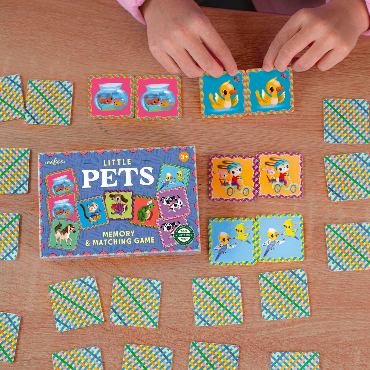 Pets Little Matching Game box with colorful animal tiles illustrated by Jill Howarth Bleck for ages 3 and up.