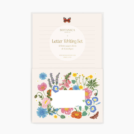 Letter writing set with floral designs on a white background
