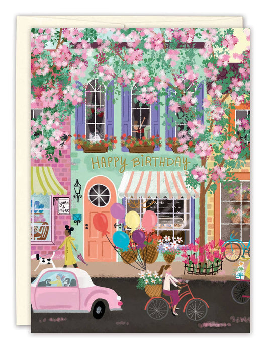 Street Scene Birthday Card illustrated by Joy Laforme featuring a colorful, charming everyday streetscape and wishes for a year of joy and adventures.