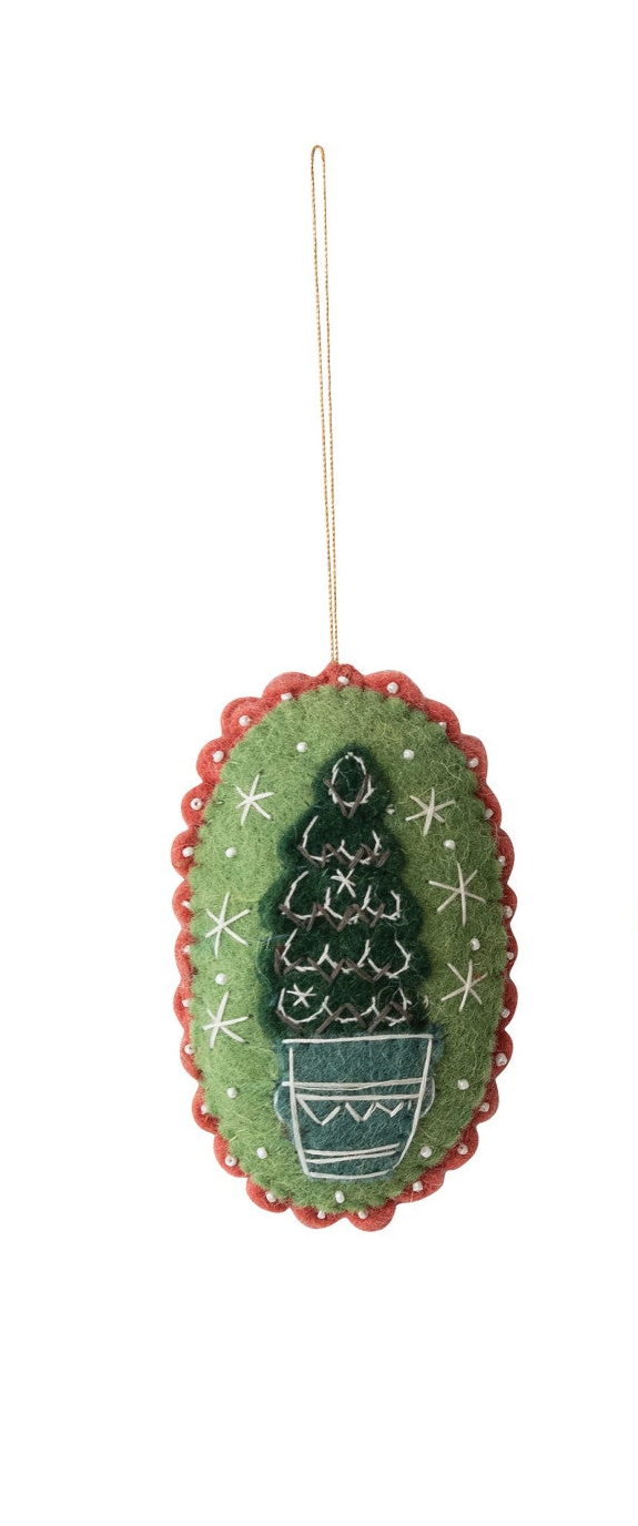 Wool felt Christmas ornament with embroidered tree in a blue pot, beaded details, and scalloped trim.