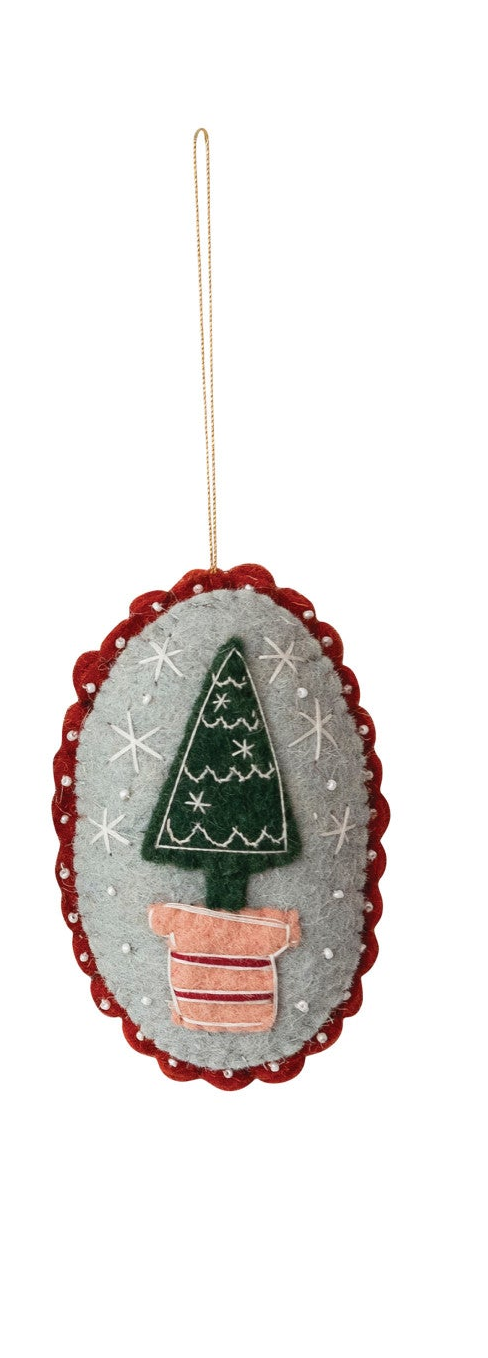 Wool felt Christmas ornament with embroidered tree in a pink pot, beaded details, and scalloped trim.