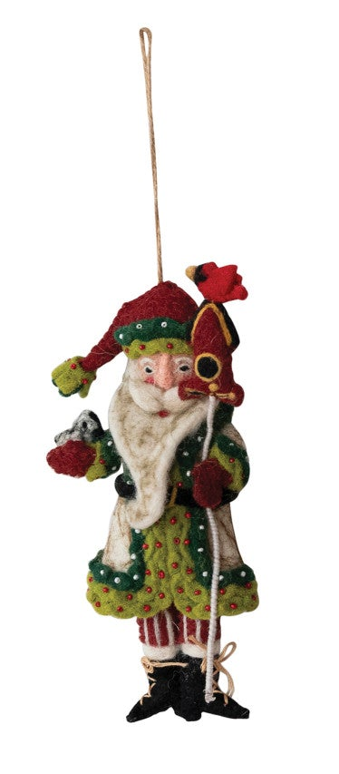 Handmade wool felt Santa Christmas ornament carrying a miniature birdhouse.