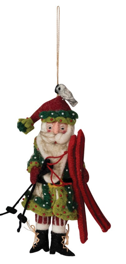 Handmade wool felt Santa Christmas ornament carrying skis.